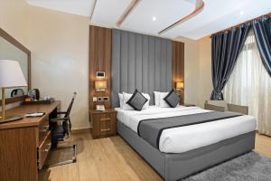 A bed or beds in a room at Watercress Hotels and Event