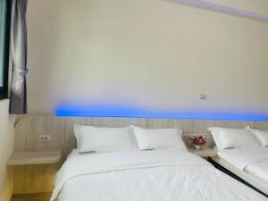 Krevet ili kreveti u jedinici u okviru objekta Penghu Roundabout Guesthouse