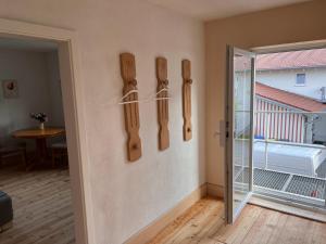 a room with wooden utensils hanging on the wall at Oberbayern Lengenfeld 2 Wohnungen a 4 Schlafzimmer Neu umgebaut in Pürgen