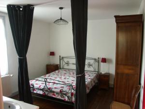 Ένα ή περισσότερα κρεβάτια σε δωμάτιο στο Gîte Val d'Oire et Gartempe