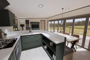 a kitchen with a table and a dining room at Tattershall Lakes Country Park in Tattershall