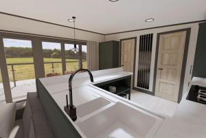 uma cozinha com um lavatório e vista para um campo em Tattershall Lakes Country Park em Tattershall