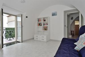 a living room with a couch and a mirror at Amalfi Coast La finestra sul Mare in Conca dei Marini