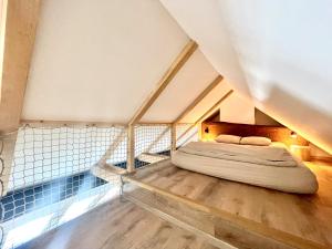 a bedroom with a bed in the attic at Apartmán Bella in Mikulov