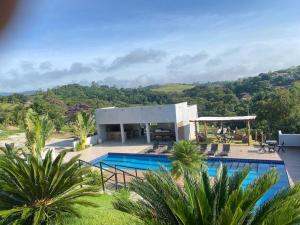 a villa with a swimming pool and a resort at CONDFLORDELIS in Santa Isabel