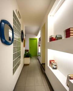 a hallway with a green door in a building at Pretoria Rooms in Palermo