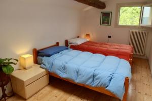 Postel nebo postele na pokoji v ubytování B&B Monte Adone