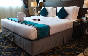 Postel nebo postele na pokoji v ubytování Omega Hotel Dubai