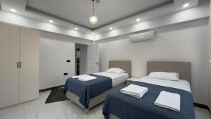Postel nebo postele na pokoji v ubytování Serenity Villa + 27 fotografií