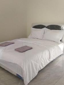 Postel nebo postele na pokoji v ubytování Selow Homestay