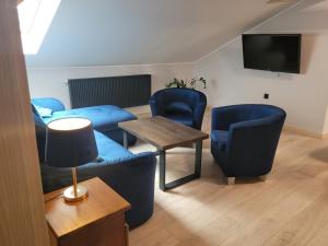TV a/nebo společenská místnost v ubytování Apartament Bocian