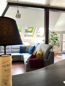 a living room with a couch and a table at Remedium Appartements in Vlotho