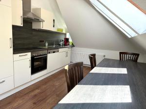 Kuchyň nebo kuchyňský kout v ubytování Remedium Appartements