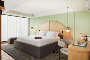 Postel nebo postele na pokoji v ubytování Wellcomm Spa & Hotel
