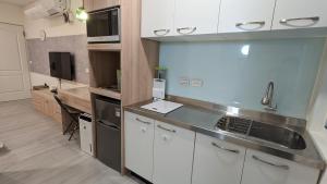 a kitchen with a sink and a counter top at 182 Heguangju in Hung-i-li