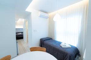 Postel nebo postele na pokoji v ubytování Hotel Nova