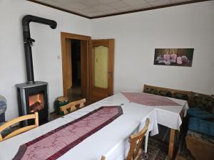 a bedroom with a bed and a fireplace at Haus Erika in Völkermarkt