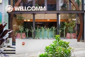 a store front with a sign that reads welcome at Wellcomm Spa & Hotel in Medellín