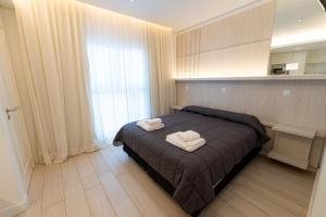 Postel nebo postele na pokoji v ubytování Hotel Nova
