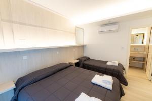 Postel nebo postele na pokoji v ubytování Hotel Nova
