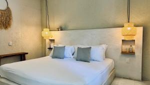 Postel nebo postele na pokoji v ubytování Hotel Noah Tulum