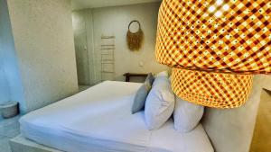 Postel nebo postele na pokoji v ubytování Hotel Noah Tulum