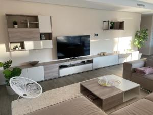 a living room with a large flat screen tv at Luxury Apartment Diego - The View Fuengirola in Fuengirola
