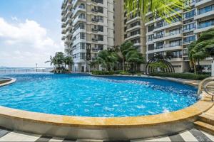 a large swimming pool in front of a building at Royal Strand, Country Garden Danga Bay, Johor Bahru, Johor in Johor Bahru