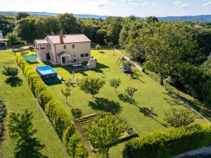 an aerial view of a house with a large yard at Paola in Kršan