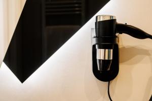 a black light attached to a white wall at Oblò Portovenere Guesthouse in Portovenere