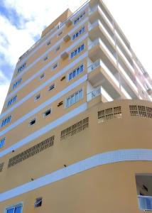 a large white building with windows on top of it at IDEAL HOTELS in Macaé