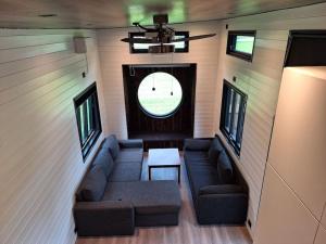 a living room with a couch and a table at Microen in Stryn