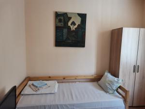 Postel nebo postele na pokoji v ubytování Guesthouse Tzar Asen + 5 fotografií
