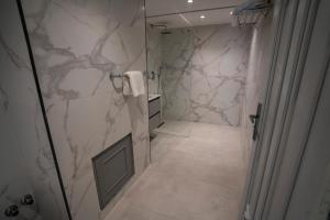 a bathroom with a walk in shower and a walk in shower at Le Rio Appart-Hotel City Center in Tangier +74 photos