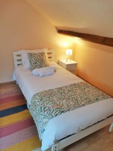 Ein Bett oder Betten in einem Zimmer der Unterkunft Gîte La Petite Fagette
