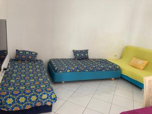 Zimmer mit 2 Betten in einem Zimmer in der Unterkunft Résidence Jlidi in Midoun
