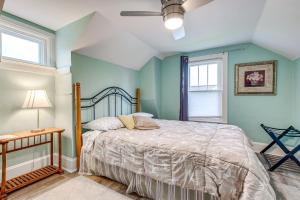 a bedroom with a bed and a ceiling fan at Lavish House with Patio - 2 Blocks to Green Lake! in Green Lake