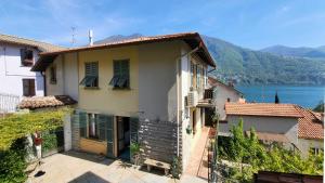 a house with a view of the water at Casa Gelsomino, Laglio, Lake Como in Laglio