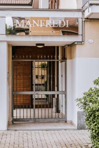 an entrance to a store with a gate at Manfredi ristorante con alloggio in Romentino