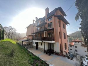 a large house on top of a hill at Panorama Guest House in Smolyan