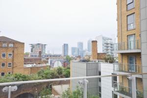 a view of a city skyline from a building at Canary Haven- Luxury 2 bedroom 2 bathroom Apartment in London