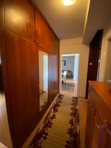 a hallway with a glass floor in a house at Dena Apartment in Kumanovo