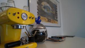 a yellow mixer sitting on top of a counter at B&B Il Vicolo Di Pizzo in Pizzo