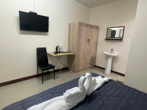 TV a/nebo společenská místnost v ubytování 2B Cozy Hostel ตรัง