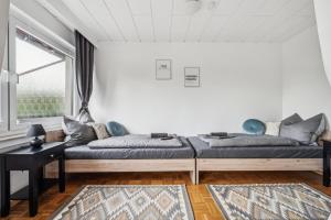 a living room with a couch and a window at P&K Apartment in Dinslaken