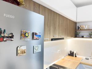 a kitchen with white walls and a counter top at Boulevard Apartaments - Vlora in Vlorë
