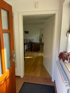 a hallway leading to a living room with a couch at Ferienwohnung Bootfahrt in Tönning