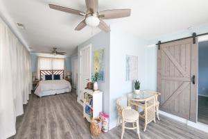 a bedroom with a bed and a ceiling fan at Dockside Daydreamin' in Ocean City