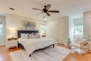 a bedroom with a bed and a ceiling fan at Fayetteville Home about 2 Blocks to Dickson Street! in Fayetteville