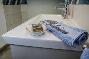 a piece of cake in a bowl on top of a toilet at Villa il Poderino in Marina di Campo